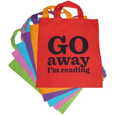 Go Away I'm Reading tote bags
